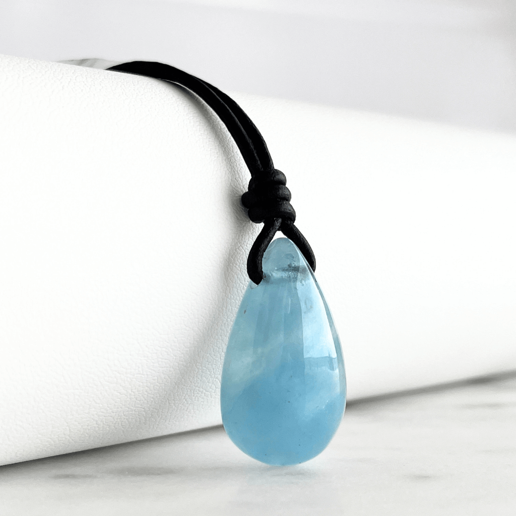 Serene Waters Aquamarine Teardrop Gemstone Pendant: A glistening aquamarine teardrop pendant, reminiscent of calm, tranquil waters.