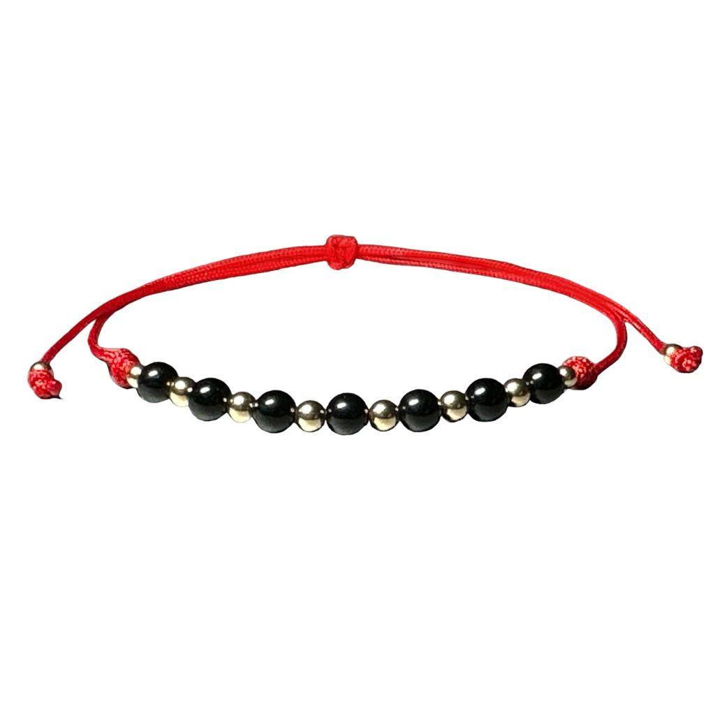 Black Tourmaline & 14K Gold Red Bracelet, showcasing the elegant blend of the protective black stone and luxurious gold accents - Luck Strings.