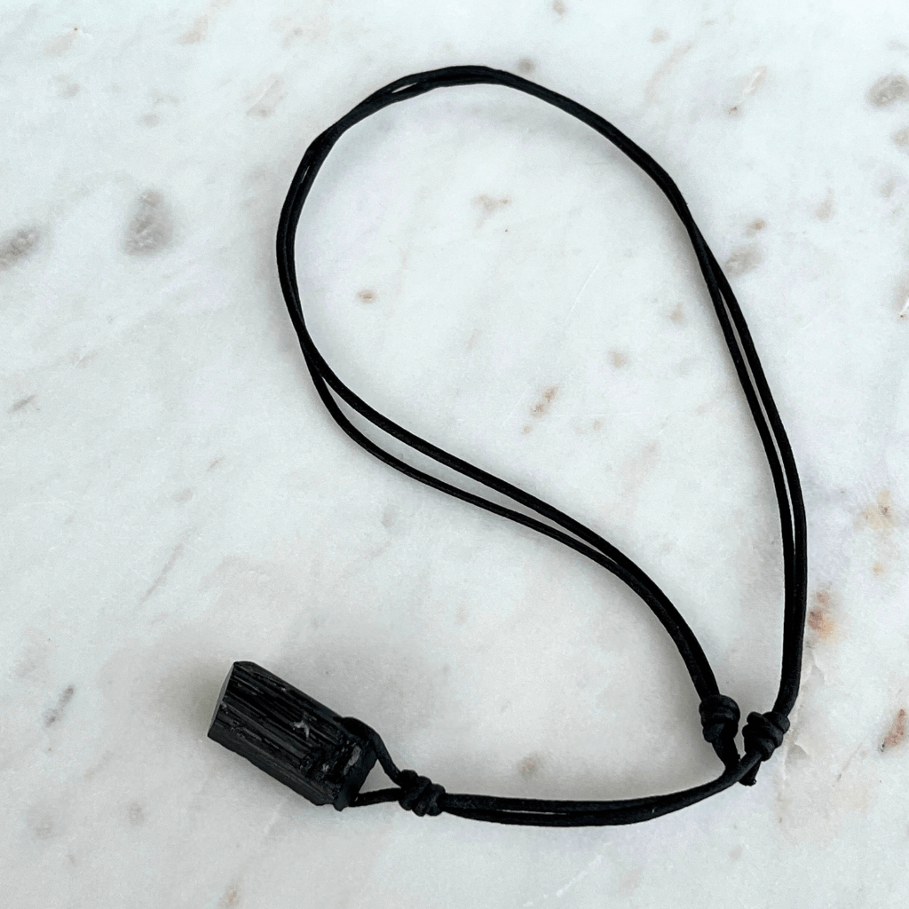 Raw Black Tourmaline Crystal Necklace - A symbol of grounding and transformation by Luck Strings.