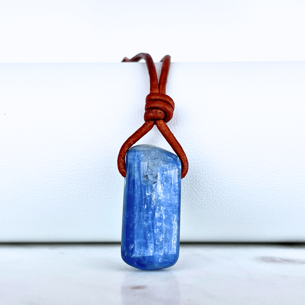 A handcrafted Kyanite pendant with elegant blue hues, symbolizing serenity and sophistication.