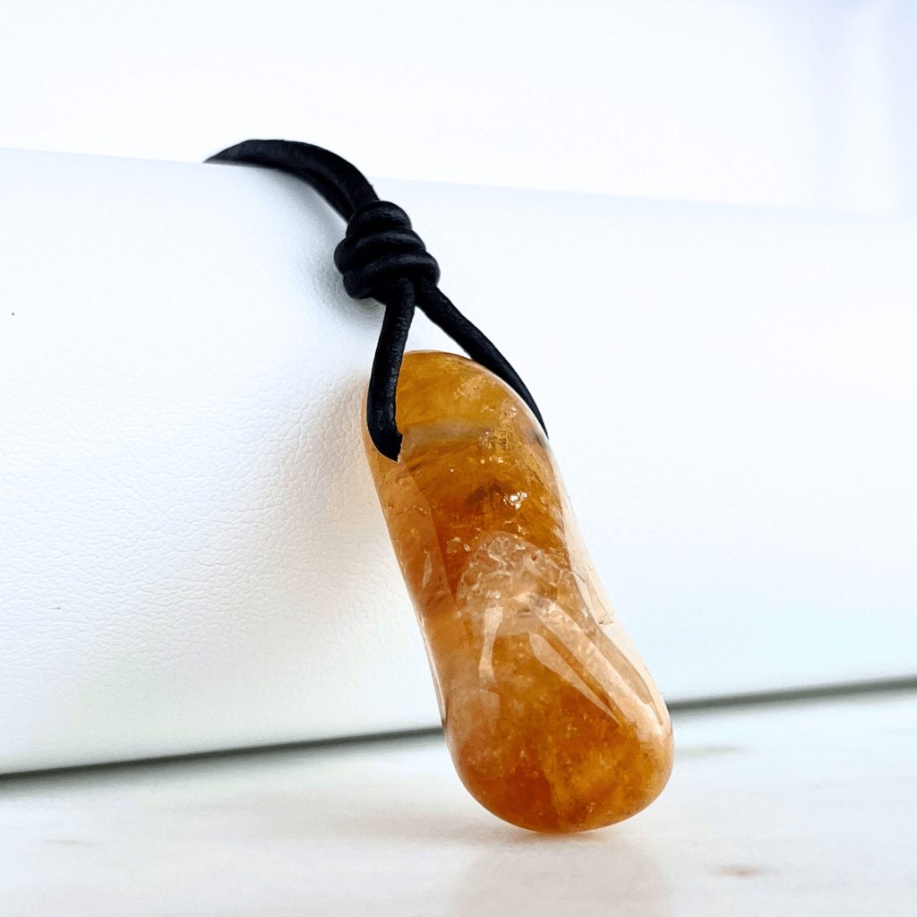 A handcrafted citrine nugget pendant, radiating elegance and charm.