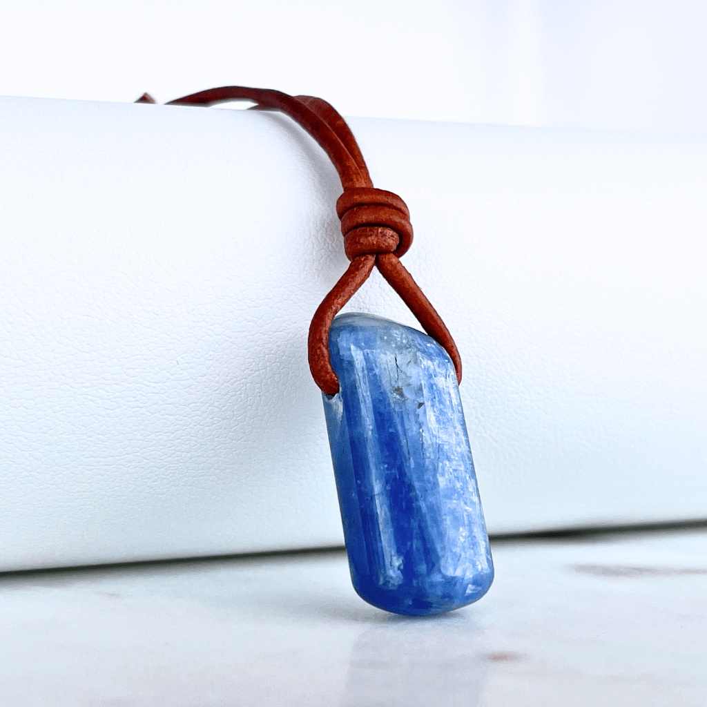 A handcrafted Kyanite pendant with elegant blue hues, symbolizing serenity and sophistication.