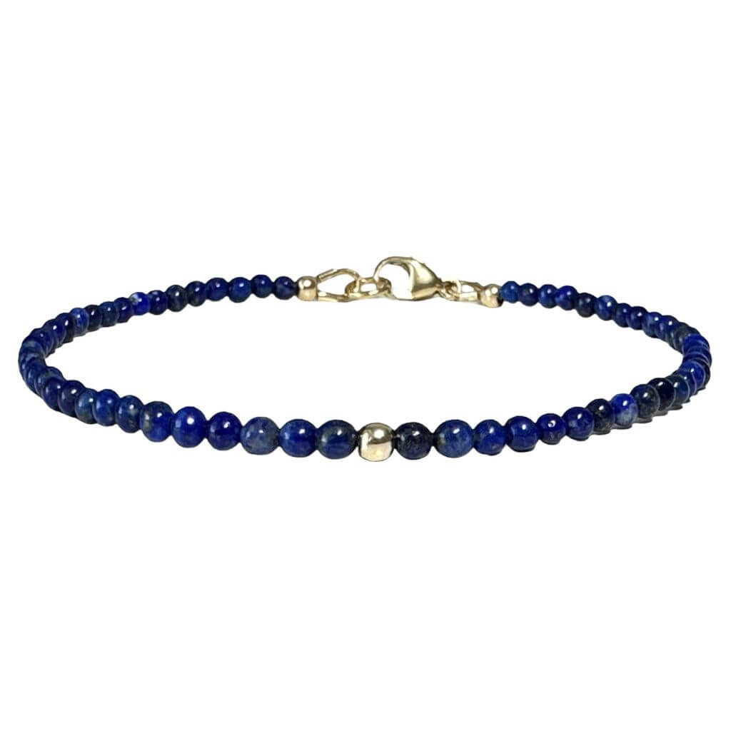 Close-up of a Lapis Lazuli &amp; 14K Solid Gold Minimalist Bracelet, displaying the deep blue lapis stones paired elegantly with refined gold accents - Luck Strings.
