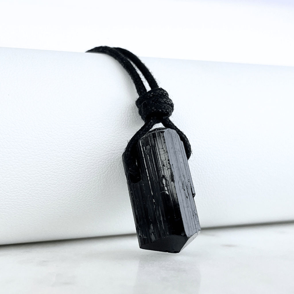 Raw Black Tourmaline Nugget Pendant - A symbol of rugged elegance and grounding by Luck Strings.