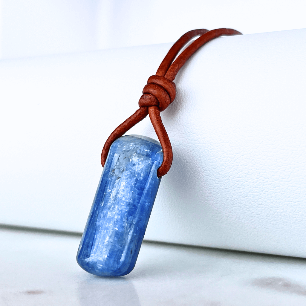 A handcrafted Kyanite pendant with elegant blue hues, symbolizing serenity and sophistication.