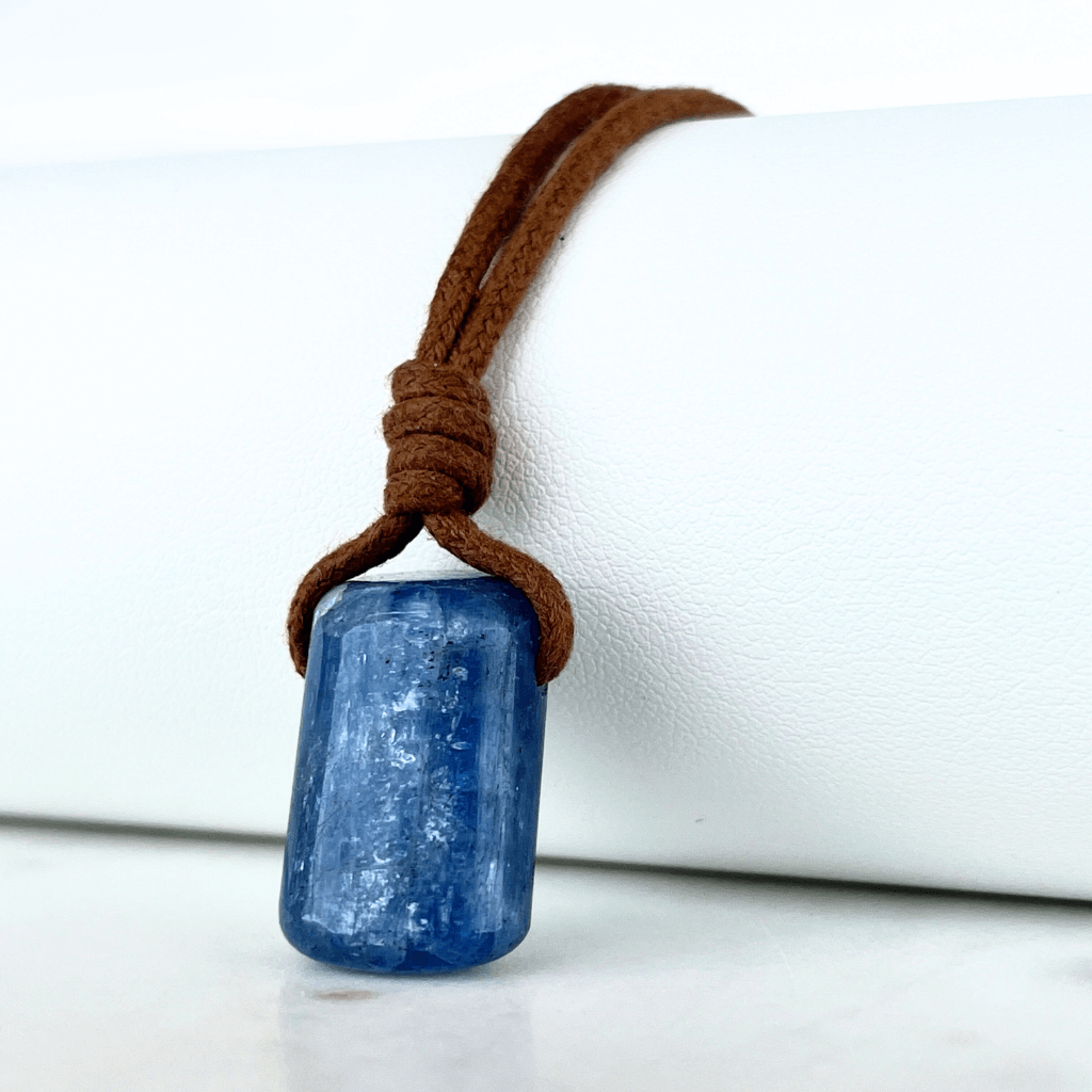 A unique handcrafted Kyanite pendant showcasing tranquil blue shades, embodying beauty and serenity.