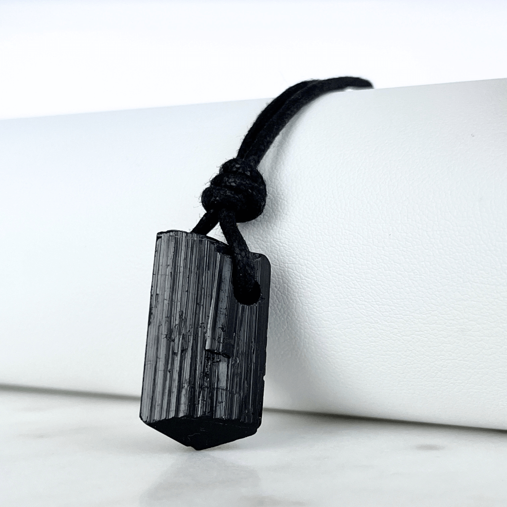 Raw Black Tourmaline Nugget Pendant - A symbol of rugged elegance and grounding by Luck Strings.