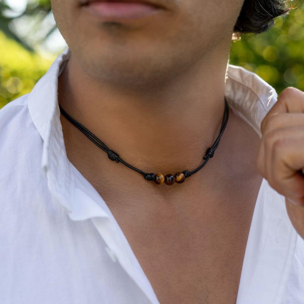 Men showcasing a Tiger Eye Choker, with the stone's distinctive golden-brown shimmer accentuating their stylish and confident look - Luck Strings