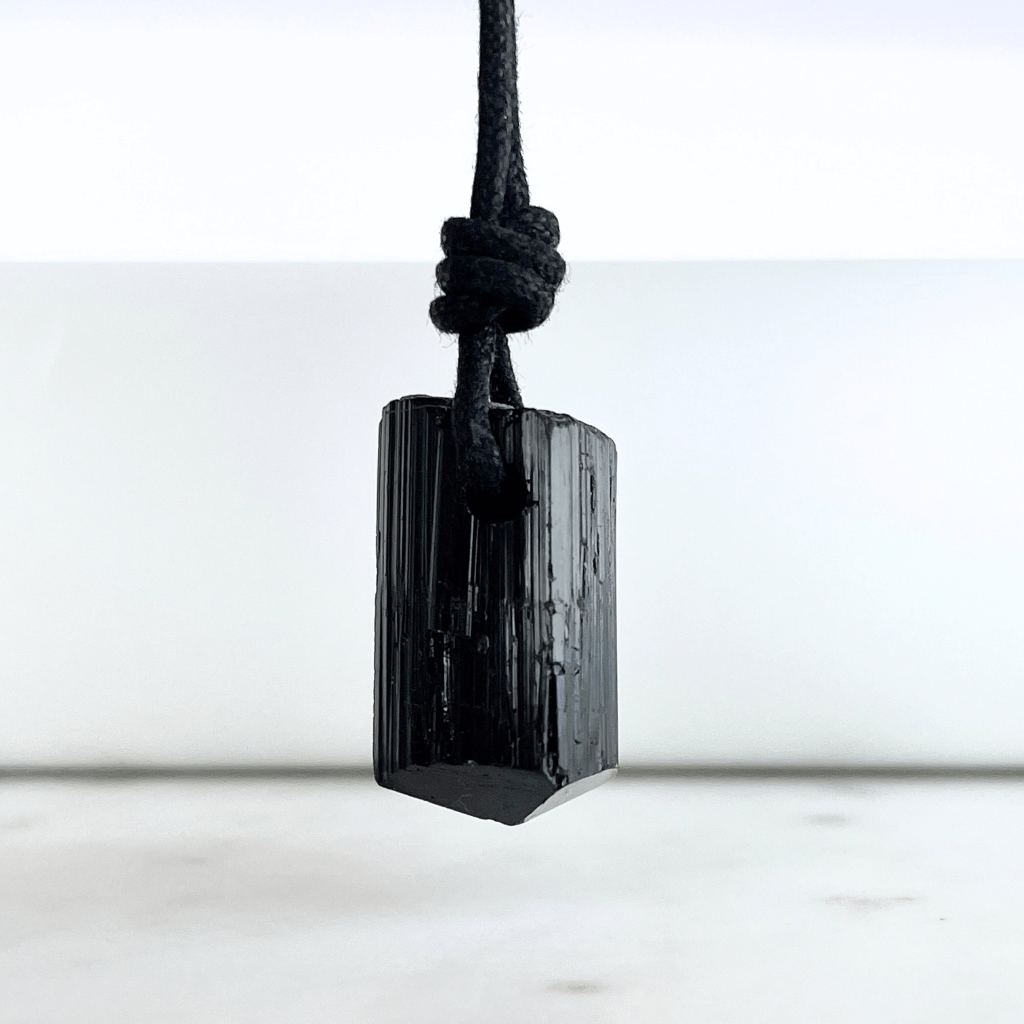 Raw Black Tourmaline Nugget Pendant - A symbol of rugged elegance and grounding by Luck Strings.