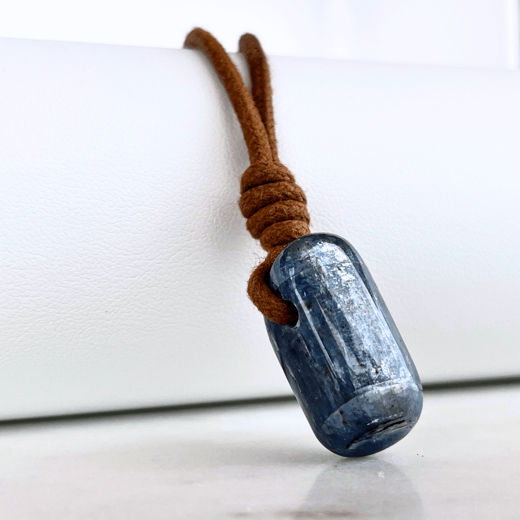 A beautiful OOAK Kyanite gemstone pendant featuring captivating blue shades, radiating beauty and uniqueness.