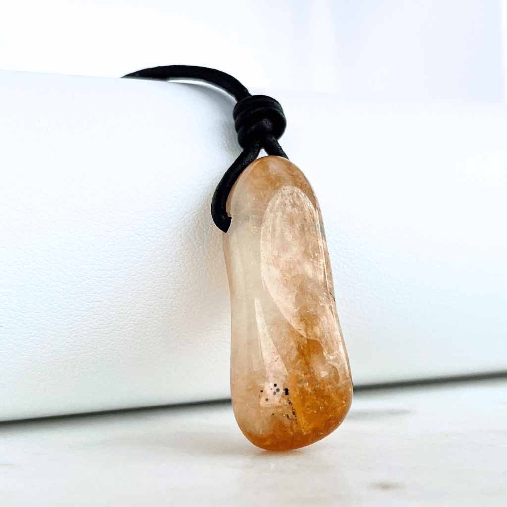 A handcrafted citrine nugget pendant, radiating elegance and charm.