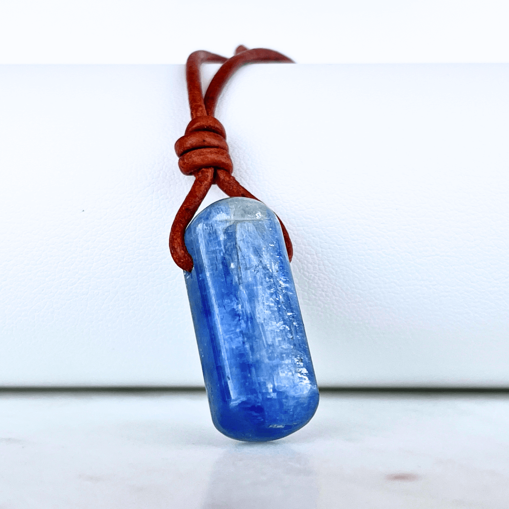 A handcrafted Kyanite pendant with elegant blue hues, symbolizing serenity and sophistication.