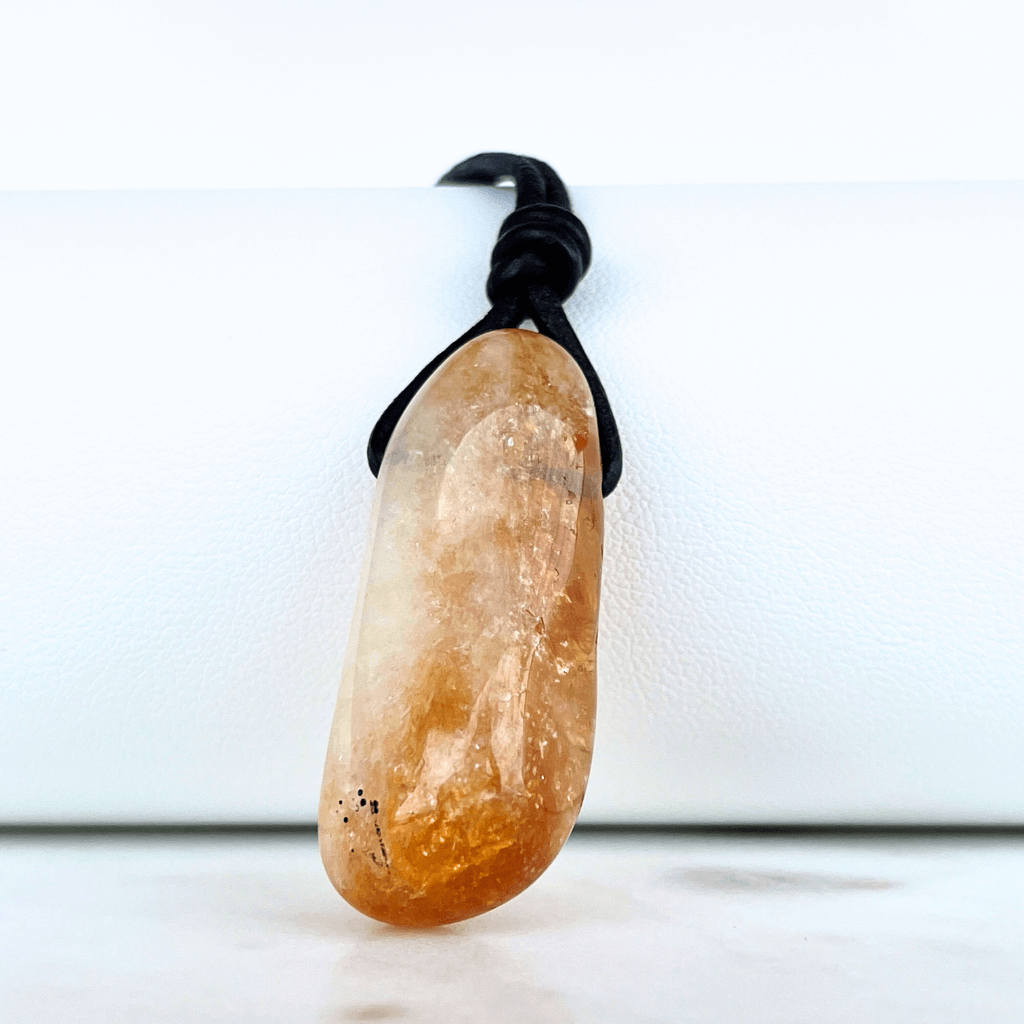 A handcrafted citrine nugget pendant, radiating elegance and charm.