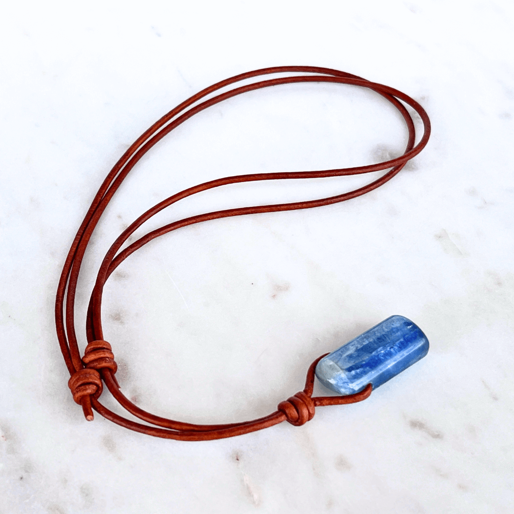 A handcrafted Kyanite pendant with elegant blue hues, symbolizing serenity and sophistication.