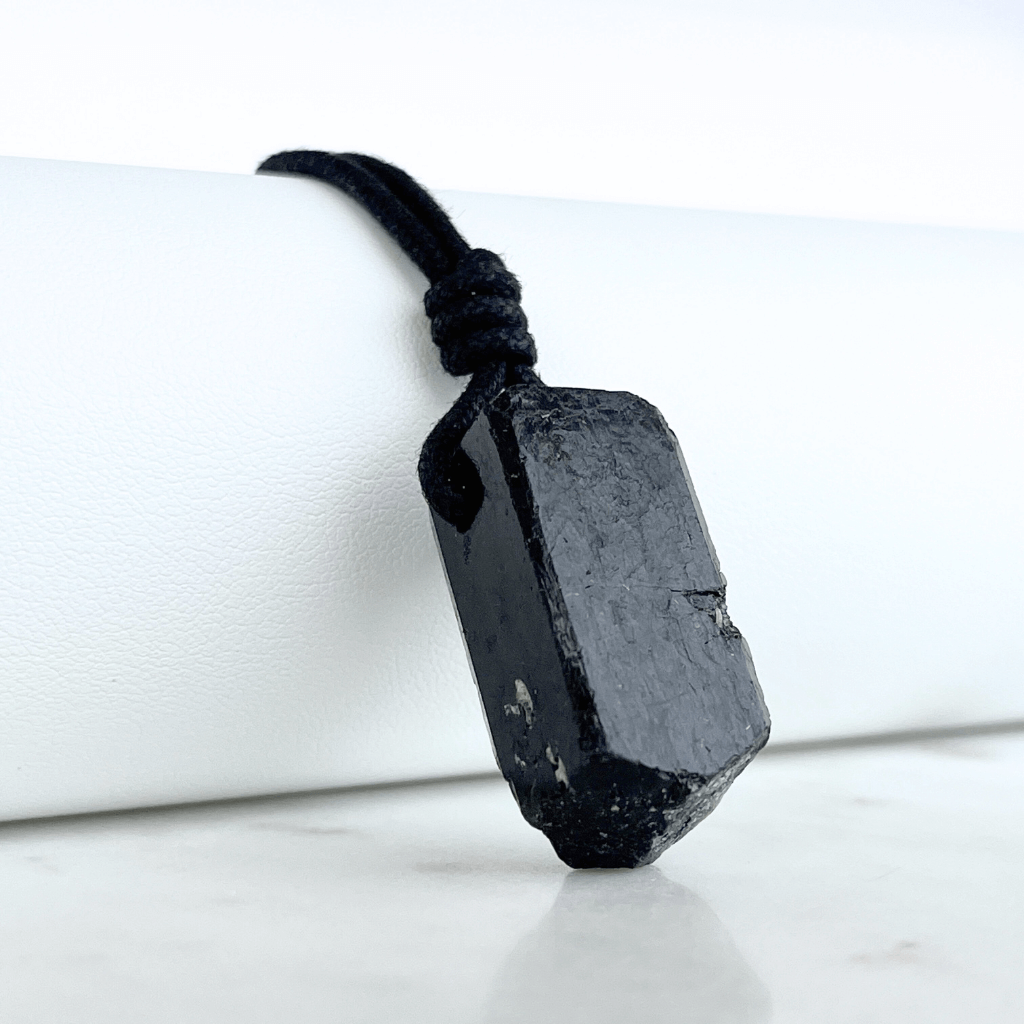 One-of-a-Kind Raw Black Tourmaline Pendant - A unique symbol of protection and individuality by Luck Strings.