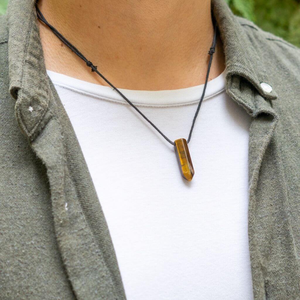 Man stylishly adorned with a Bullet Point Gemstone Necklace, reflecting his personal style and choice of gemstone - Luck Strings