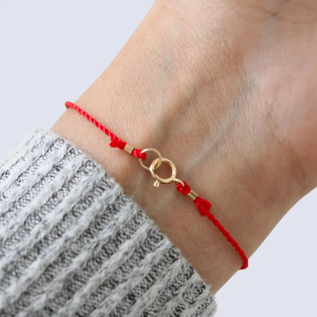 Red silky cord bracelet with solid gold secure clasp, showcasing a minimalist and elegant design. - Luck Strings