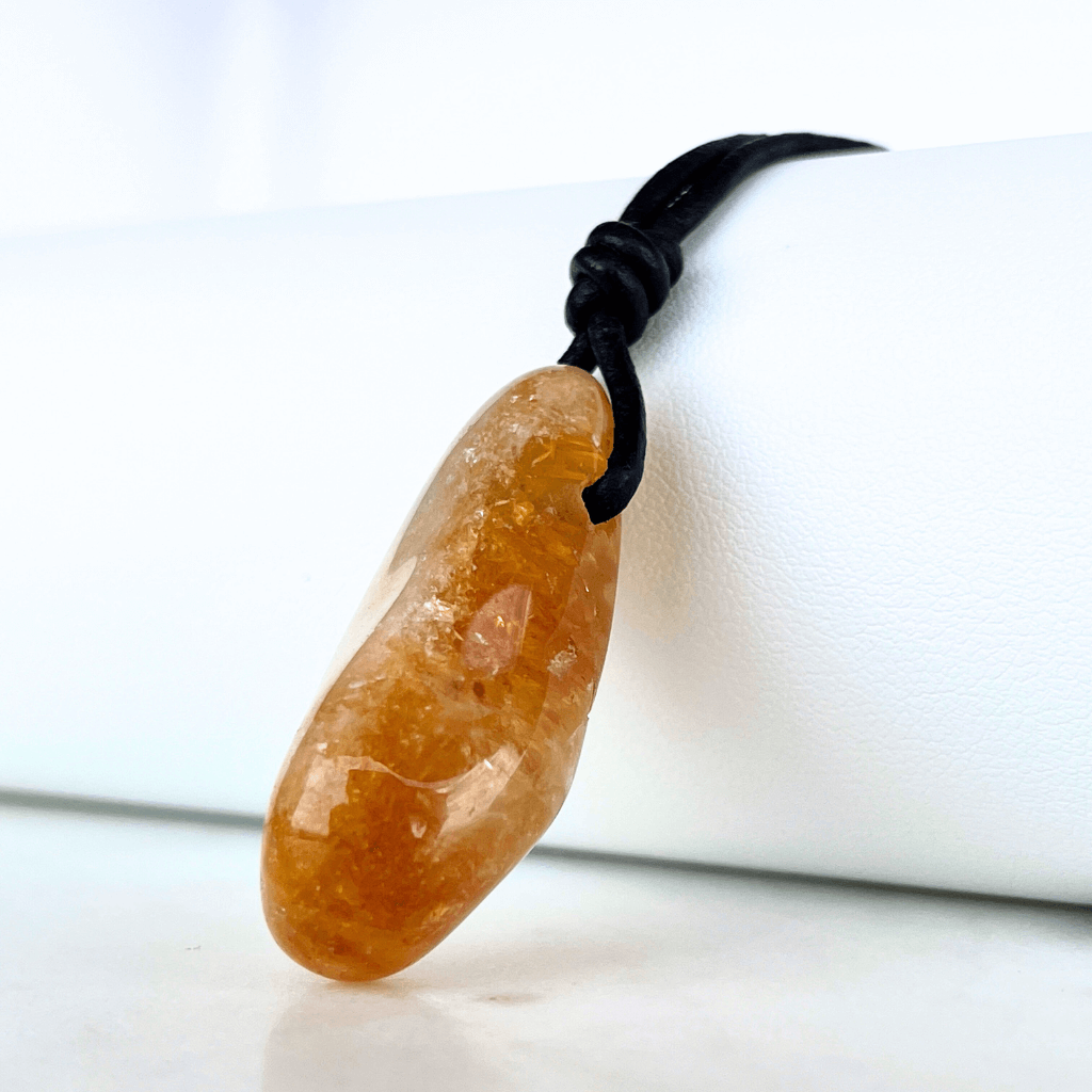 A handcrafted citrine nugget pendant, radiating elegance and charm.