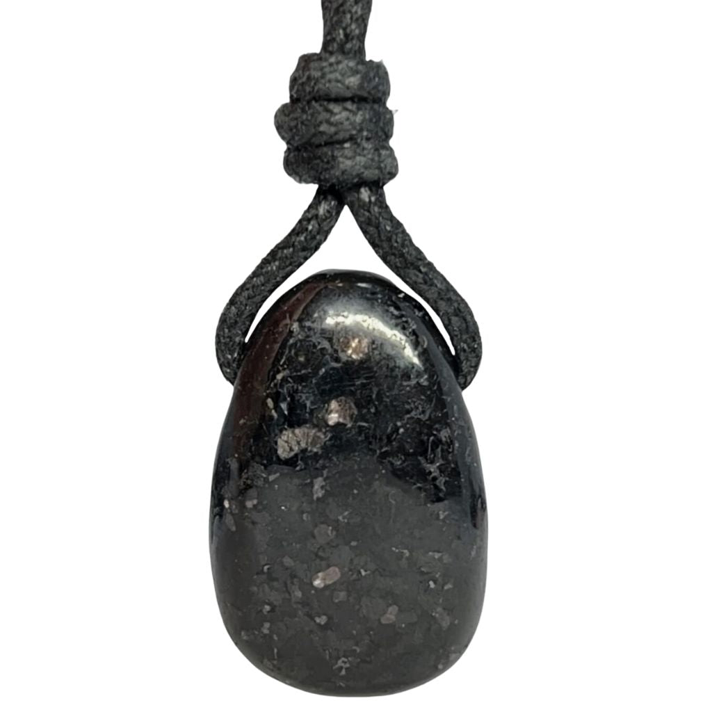 Luck Strings' Nuummite pendant showcased on a wax cotton cord, blending natural stone beauty with casual elegance.