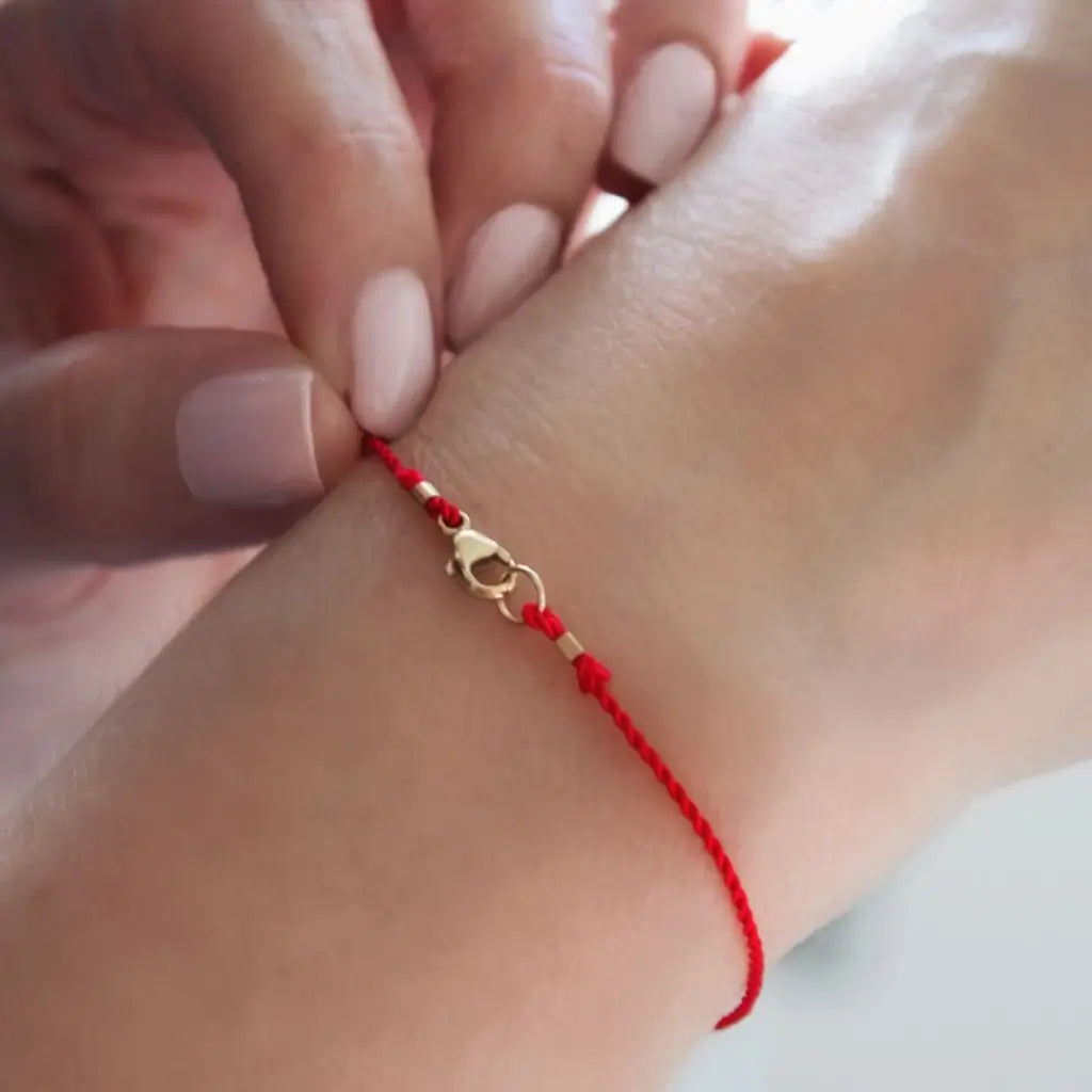 Red silky cord bracelet with solid gold lobster secure clasp, showcasing a minimalist and elegant design. - Luck Strings