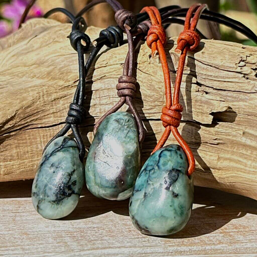 Luck Strings-Trio of emerald stones handcrafted on a leather cord with adjustable sliding knots