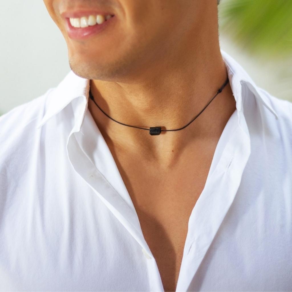 Man adorned with a Black Tourmaline Choker Necklace, showcasing how the protective bead enhance his style with a touch of sophistication and good fortune - Luck Strings